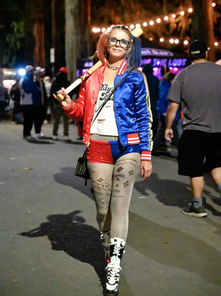 Vegi Hoyt dressed as Harley Quinn carrying a baseball bat at Halloweird 2026 in Hillsboro, Oregon.